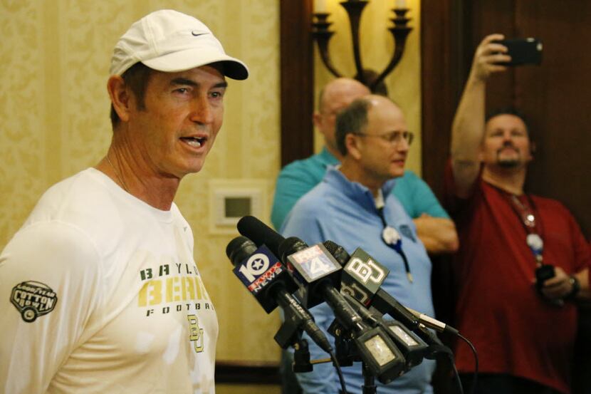 Baylor head coach Art Briles talks with the media during the Baylor Cotton Bowl media...