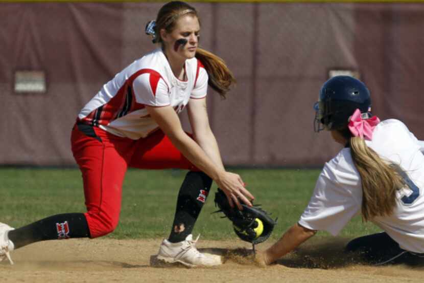 Flower Mound player Megan Gordan (9) is safe at second under the tag of Flower Mound Marcus...