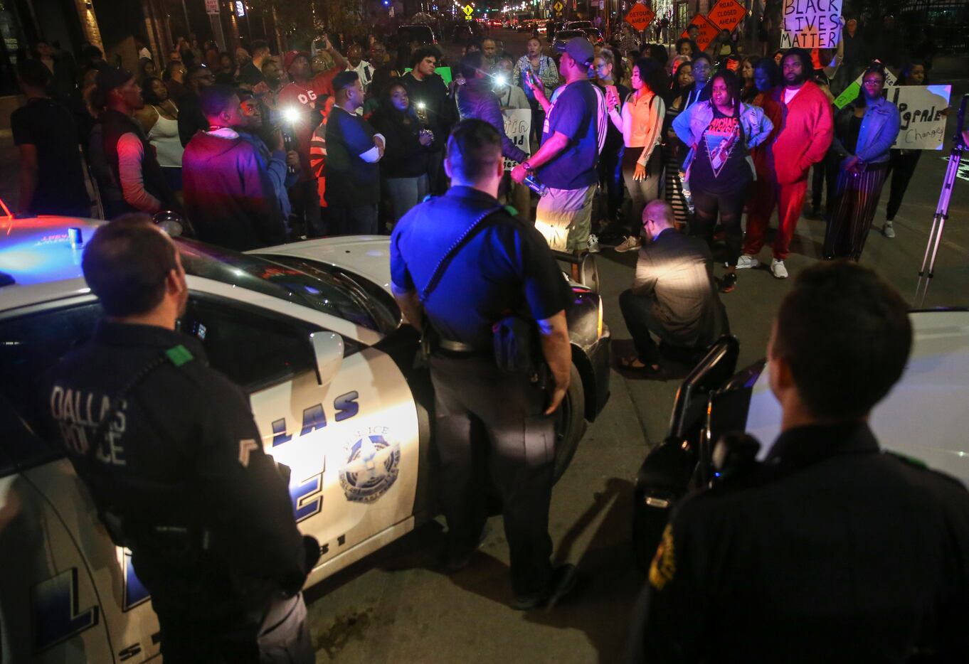 Demonstrators marching through the streets during a protest Saturday, March 23, in Dallas'...