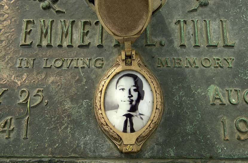 Emmett Till's photo adorns his grave marker  in Alsip, Ill. His mother insisted that he have...