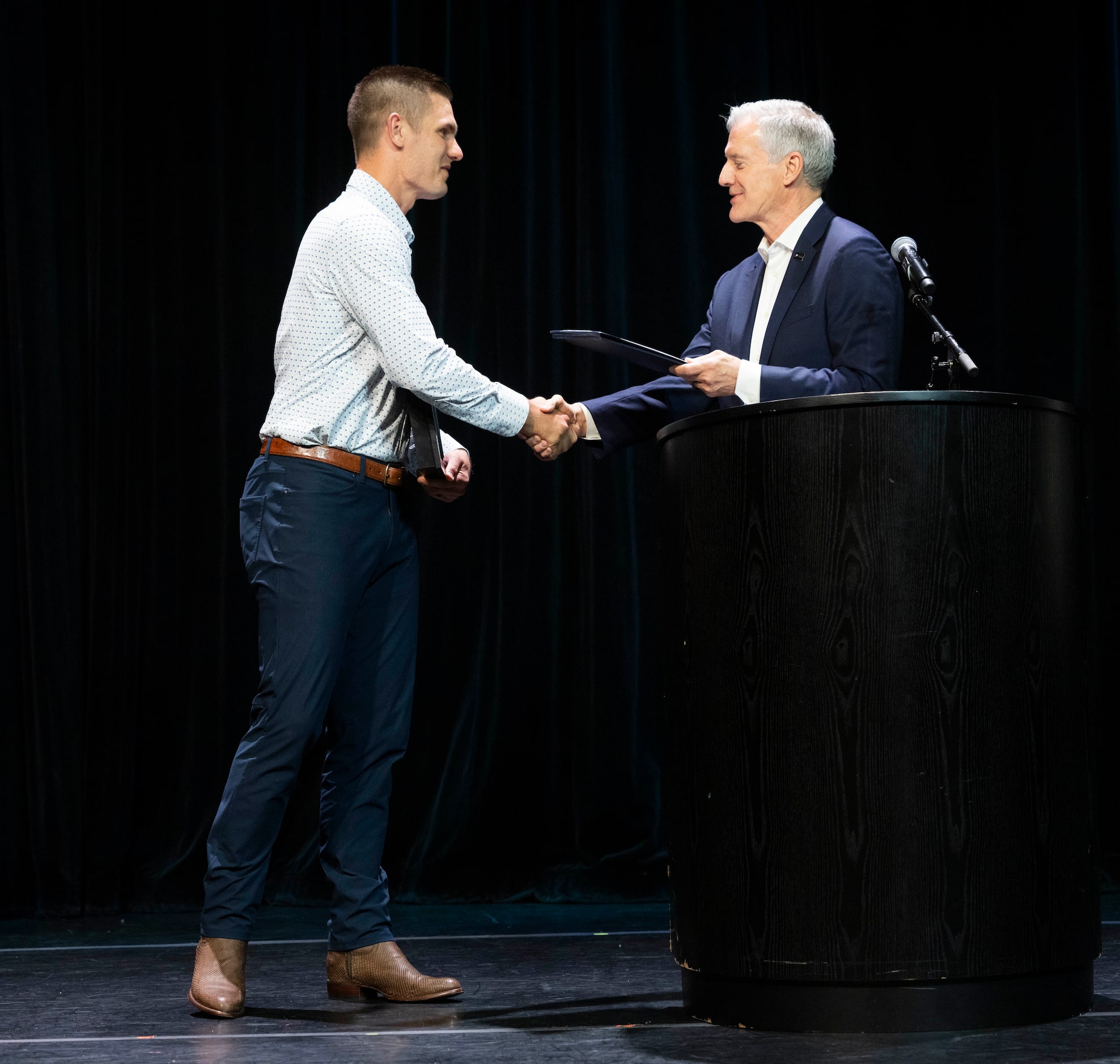 Plano native and Dallas Cowboys kicker Brandon Aubrey, left, is presented the key to the...