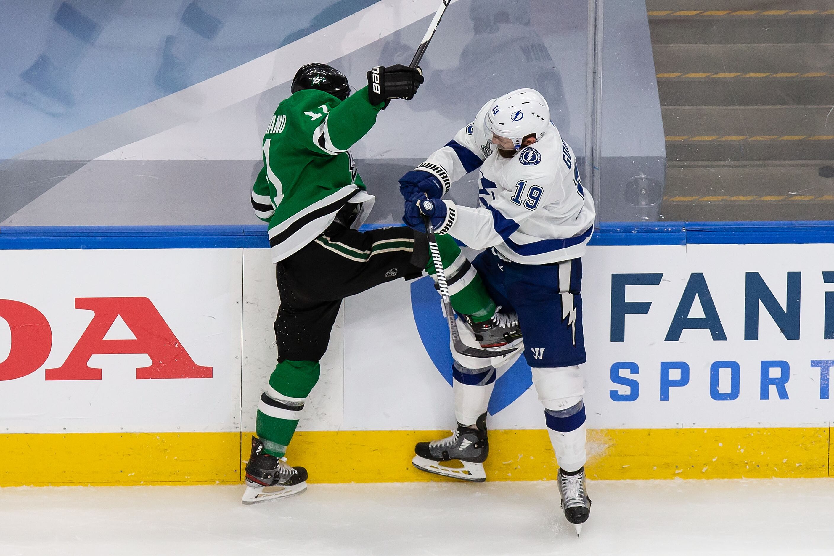 Nick Caamano (17) of the Dallas Stars gets his skate into Barclay Goodrow (19) of the Tampa...