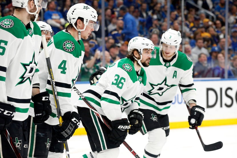 Dallas Stars center Mats Zuccarello (36) is congratulated by teammates after scoring a first...