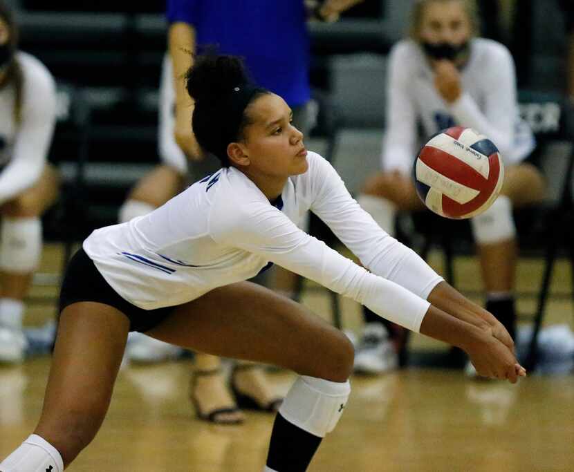 Denton Guyer High School outside hitter Kyndal Stowers (5) makes pass during game two as...