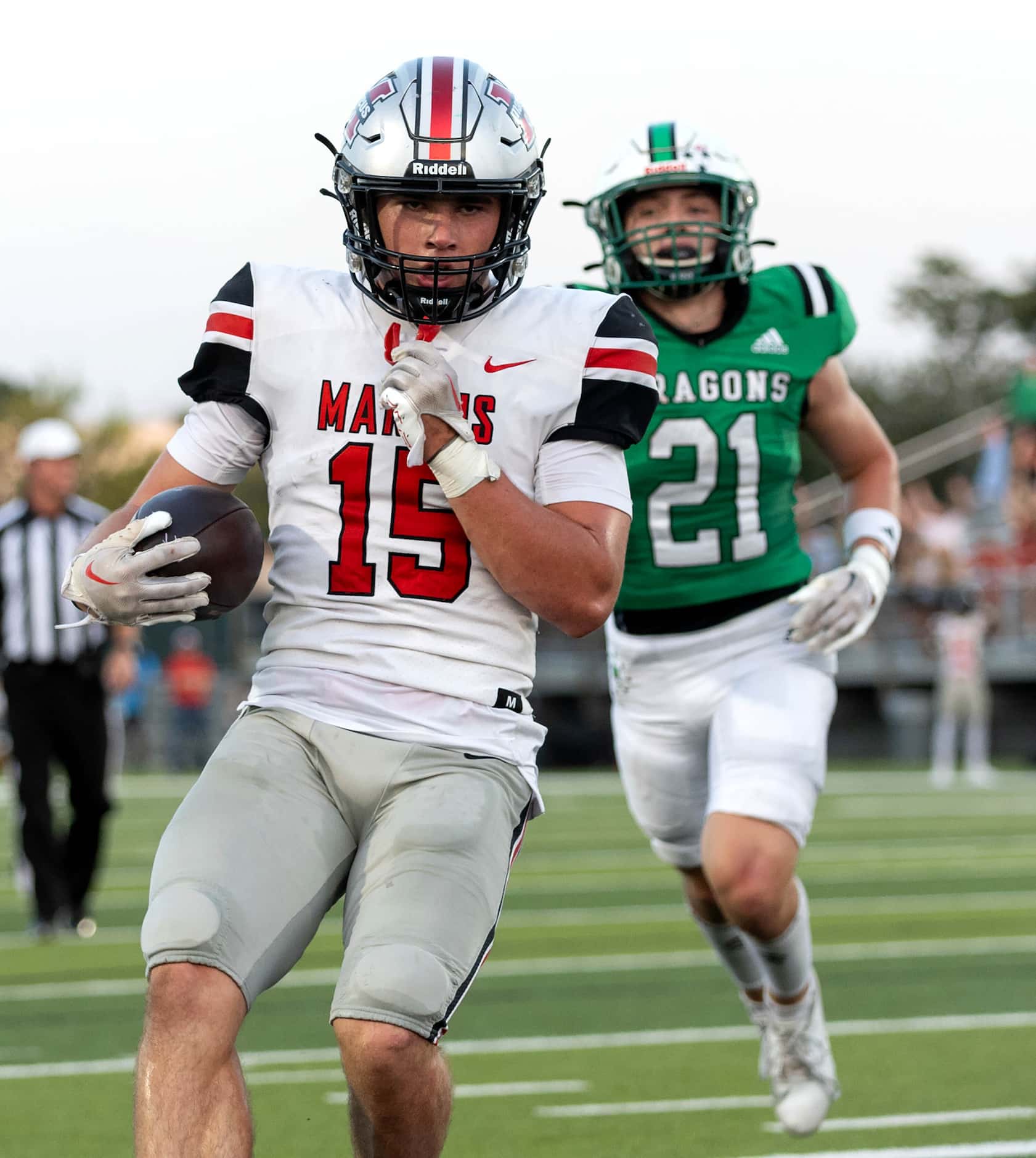 Flower Mound Marcus quarterback Brock Golwas (15) gets into the endzone for a rushing...