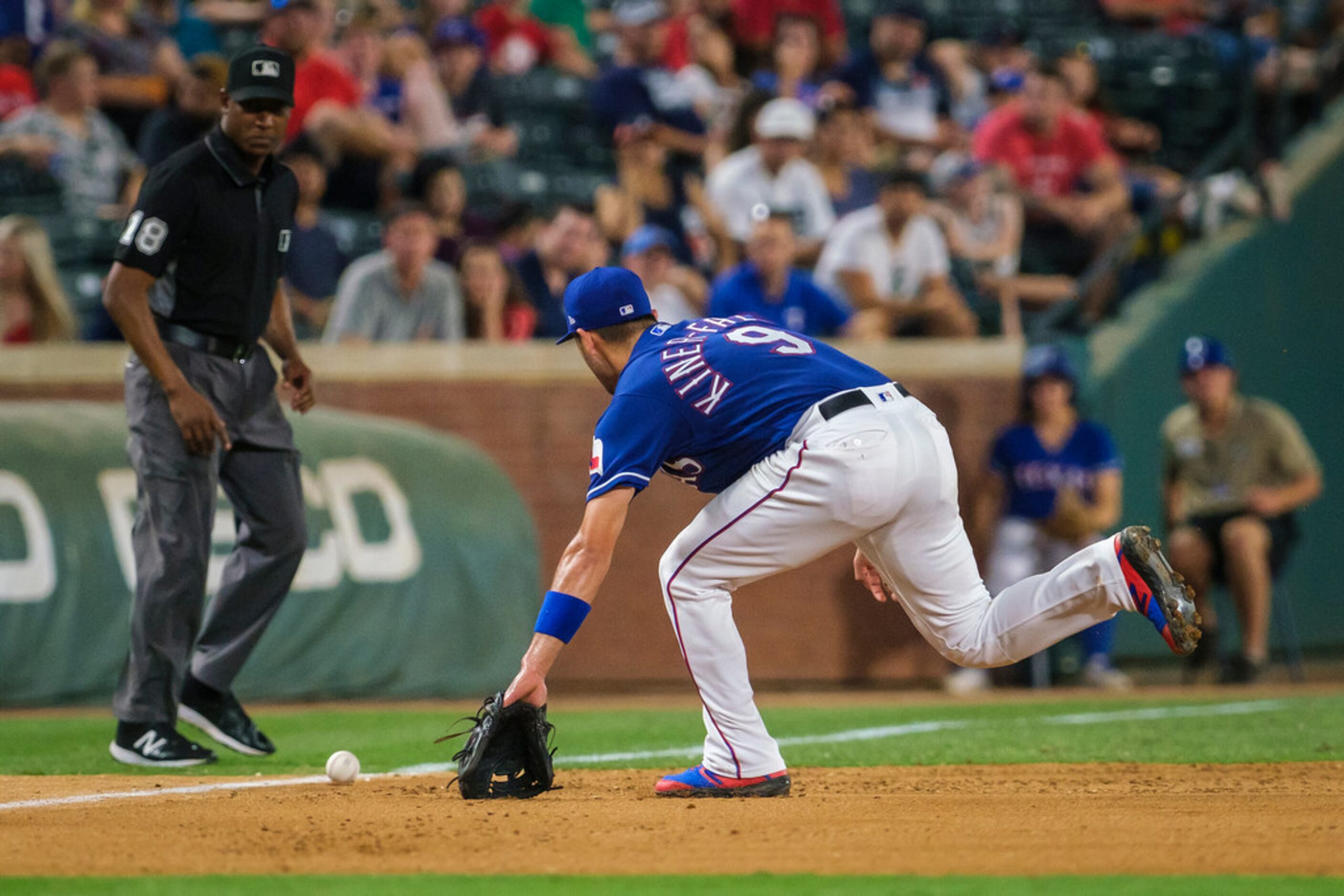 Texas Rangers third baseman Isiah Kiner-Falefa canÃt make the play on a triple off the bat...