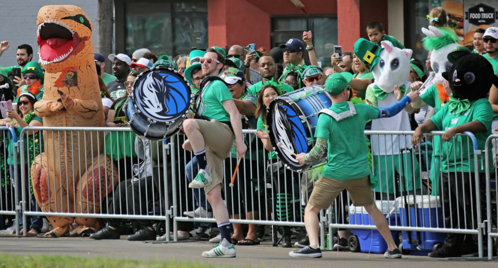 The Dallas Mavericks Drumline entertains the crowd along the route during the Dallas St....