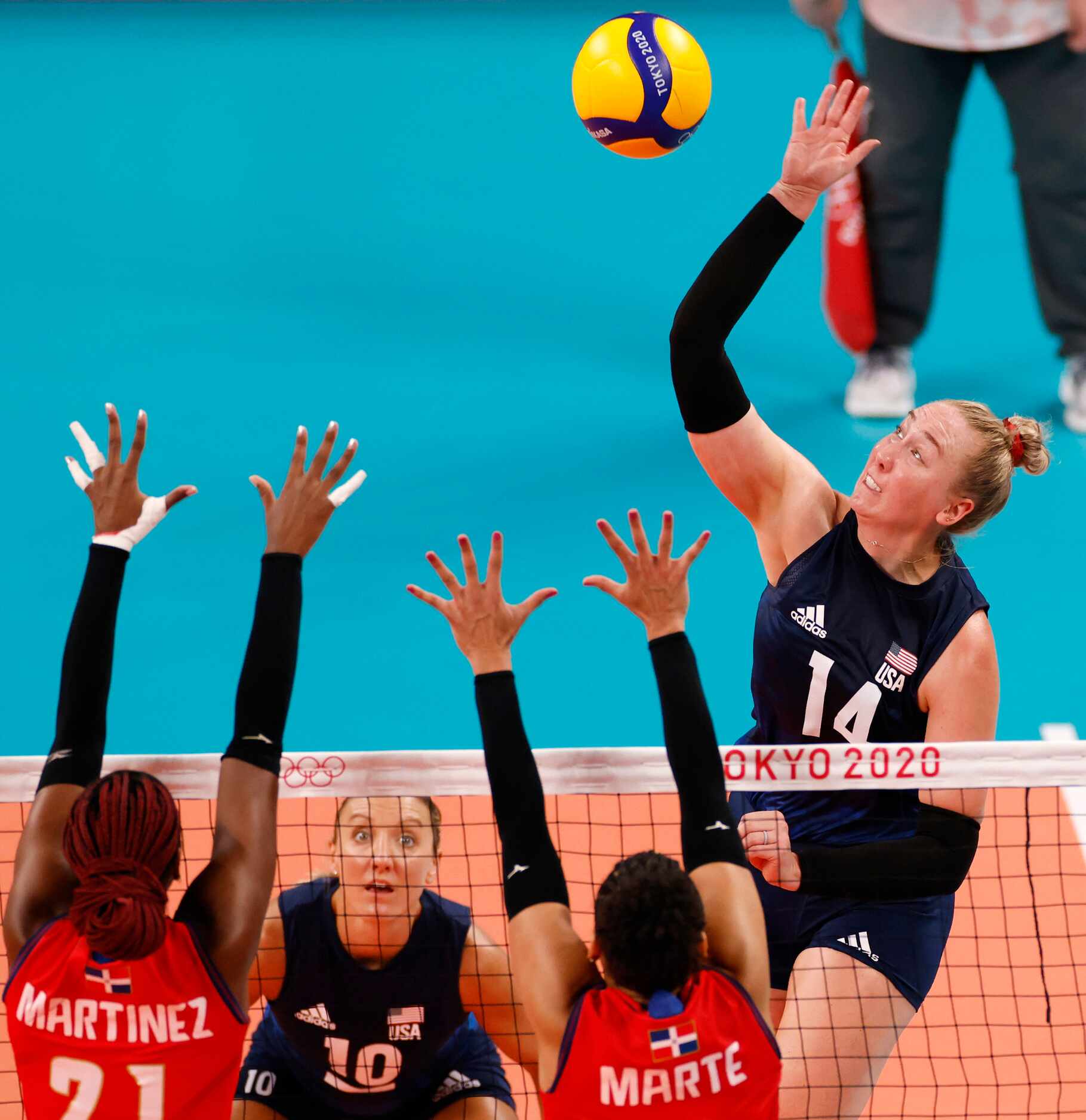 USA’s Michelle Bartsch-Hackley (14) hits the ball as Dominican Republic’s Jineiry Martinez...