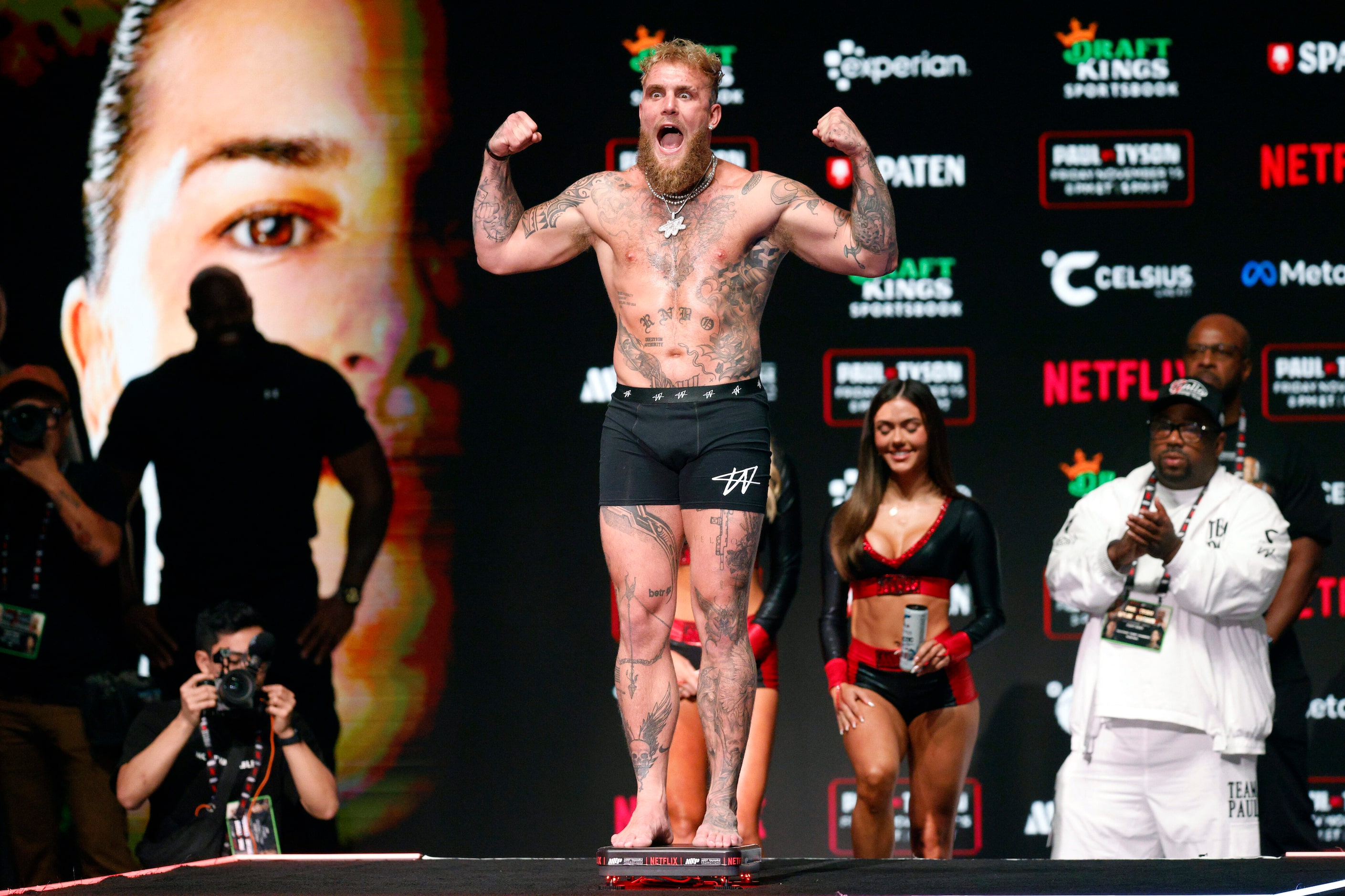 Jake Paul flexes as screams during public weigh-ins before his boxing match against Mike...