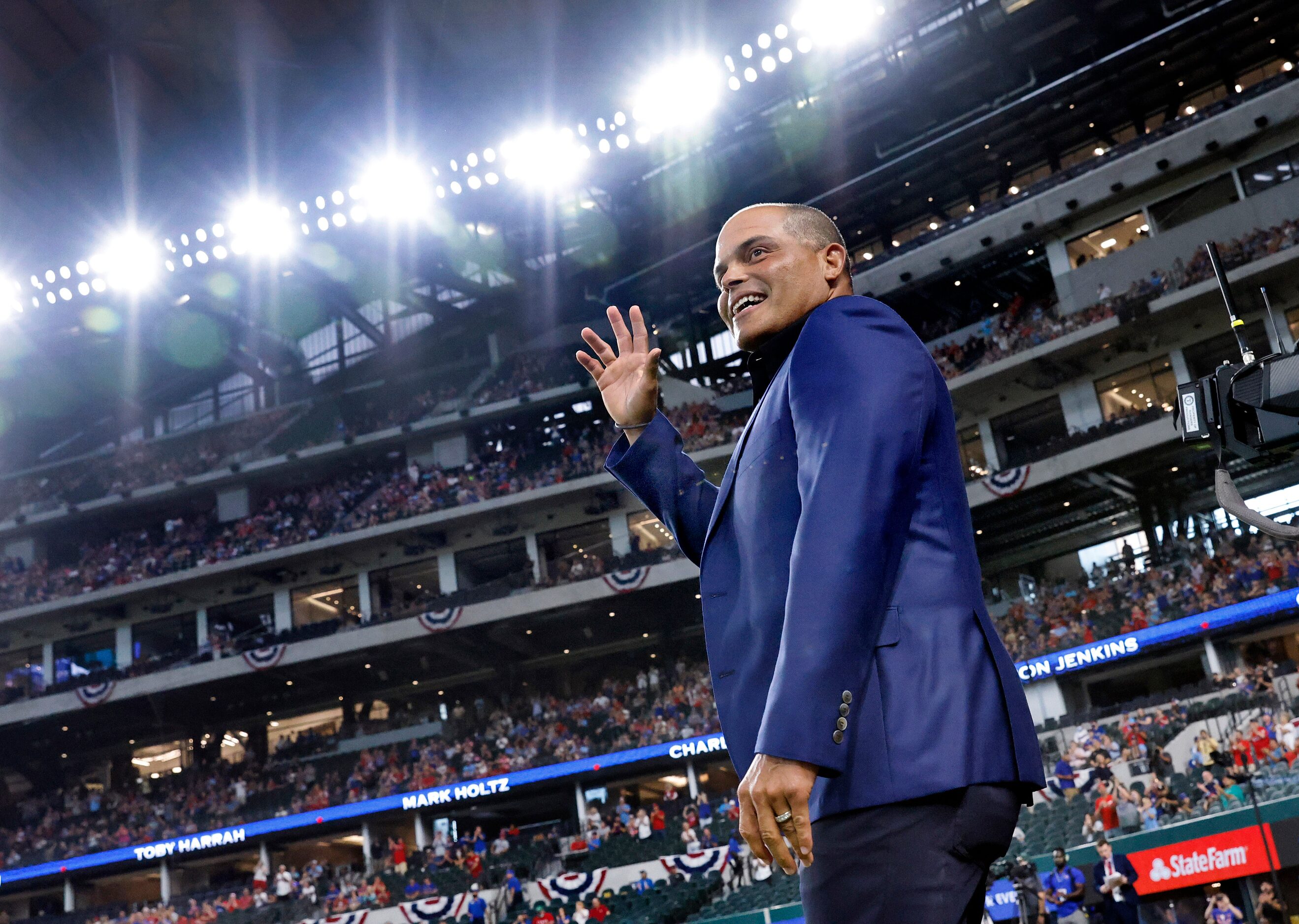 Texas Rangers Baseball Hall of Fame member Ivan 'Pudge' Rodriguez waves to the crowd as he's...