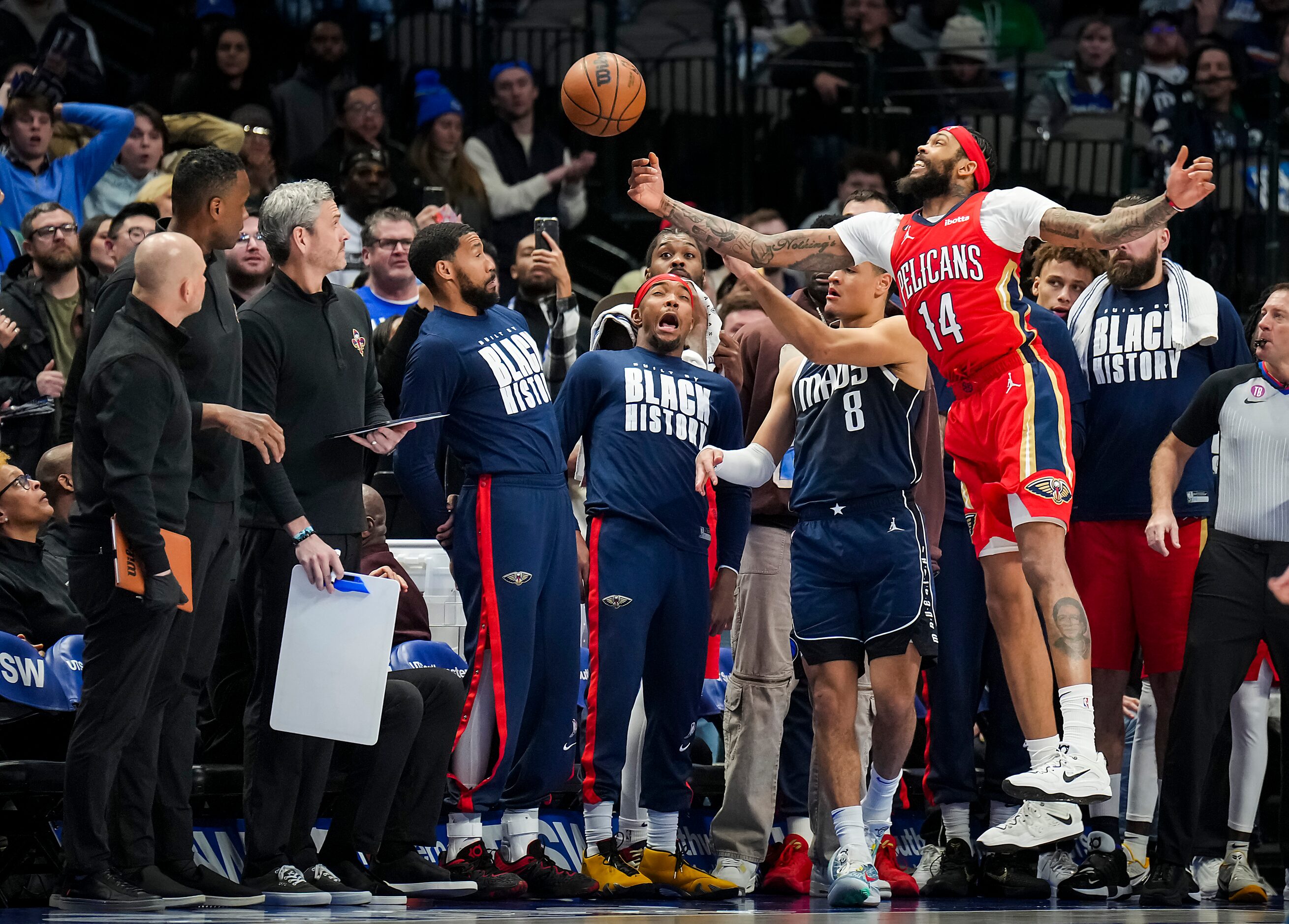 New Orleans Pelicans forward Brandon Ingram (14) tries to knock an inbounds pass away from...