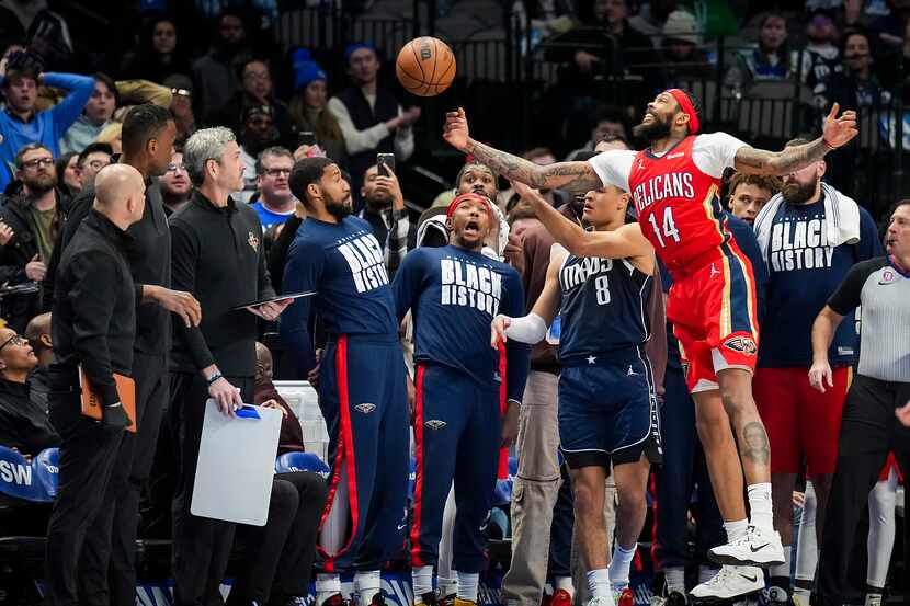 New Orleans Pelicans forward Brandon Ingram (14) tries to knock an inbounds pass away from...
