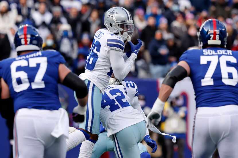 Dallas Cowboys cornerback Jourdan Lewis intercepts New York Giants quarterback Mike...