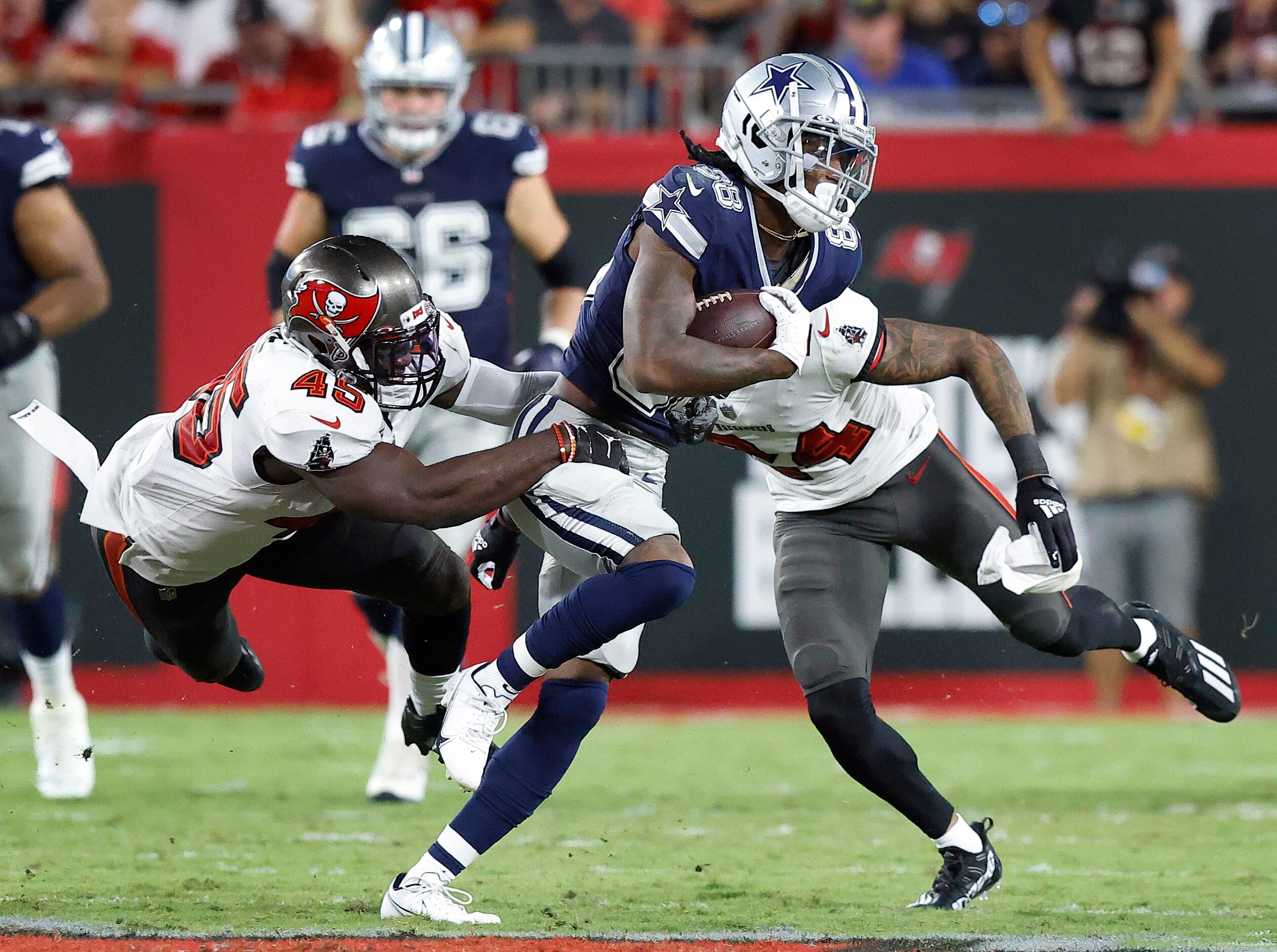 Tampa Bay Buccaneers linebacker Devin White (45) tries to make a tackle of Dallas Cowboys...