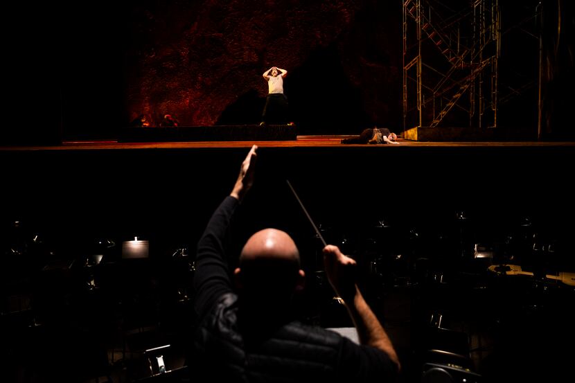 Baritone Michael Mayes performs as music director Emmanuel Villaume conducts during a...