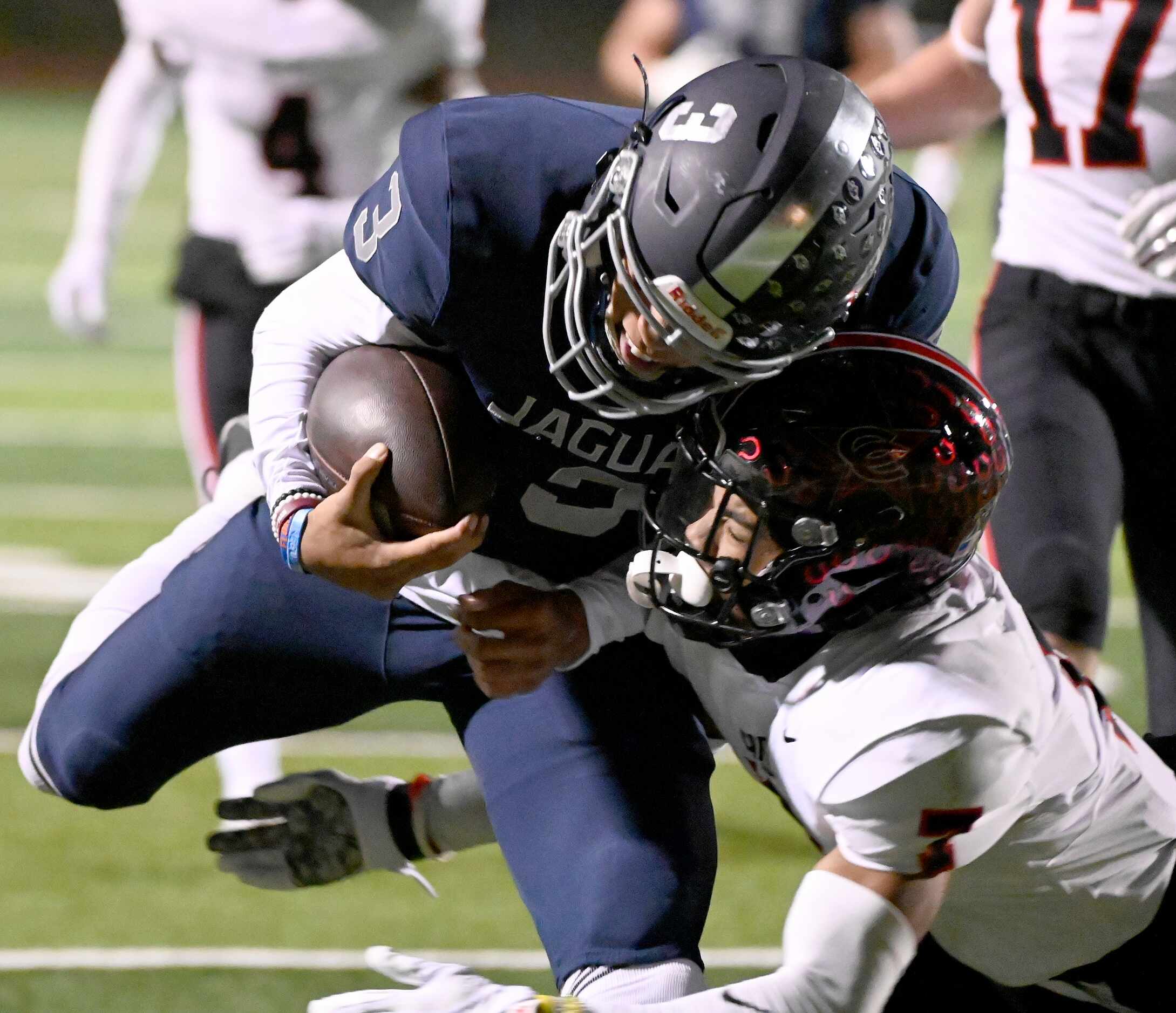 Flower Mound quarterback Nick Evers (3) is tackled by Coppell's Isaiah Nichols (7) in the...