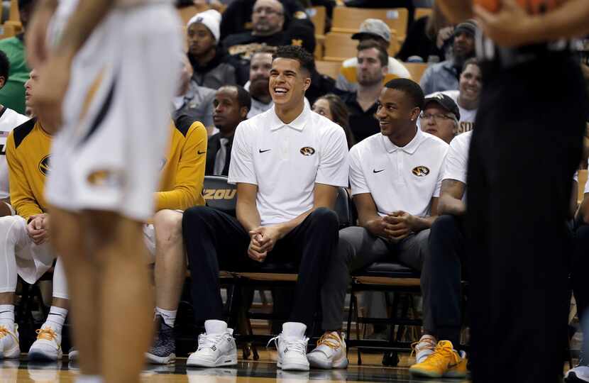FILE - In this Dec. 5, 2017 file photo, Missouri's Michael Porter Jr. laughs on the bench...