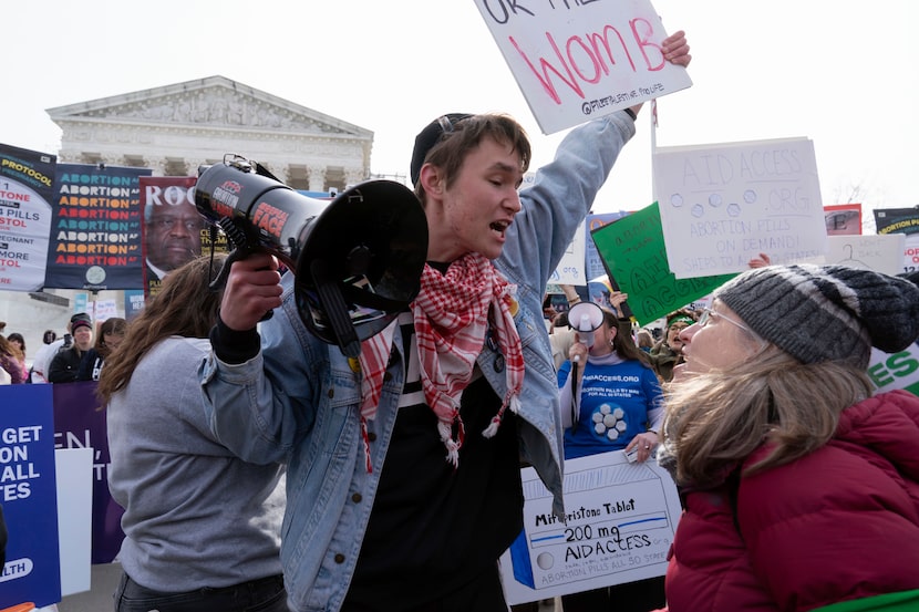 Anti-abortion and abortion rights activists, rally outside the Supreme Court, Tuesday, March...