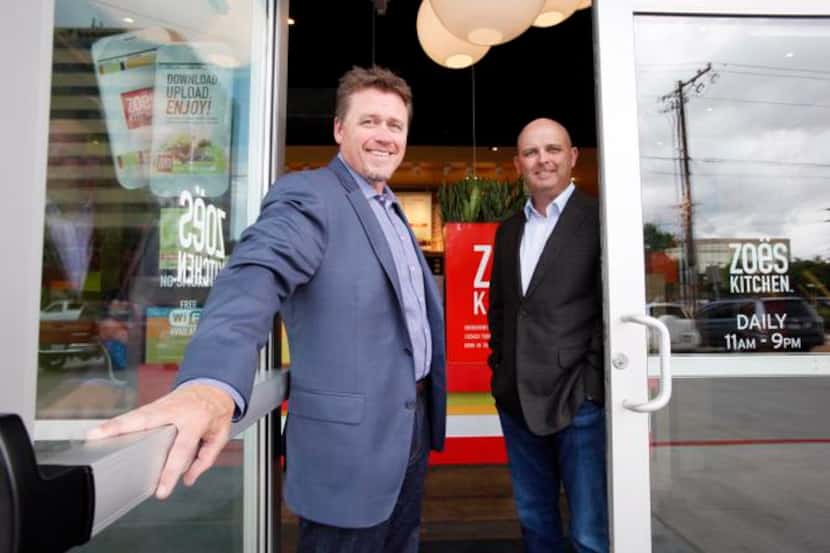 
Kevin Miles (left), president and CEO of Zoe’s Kitchen, with chief financial officer Jason...