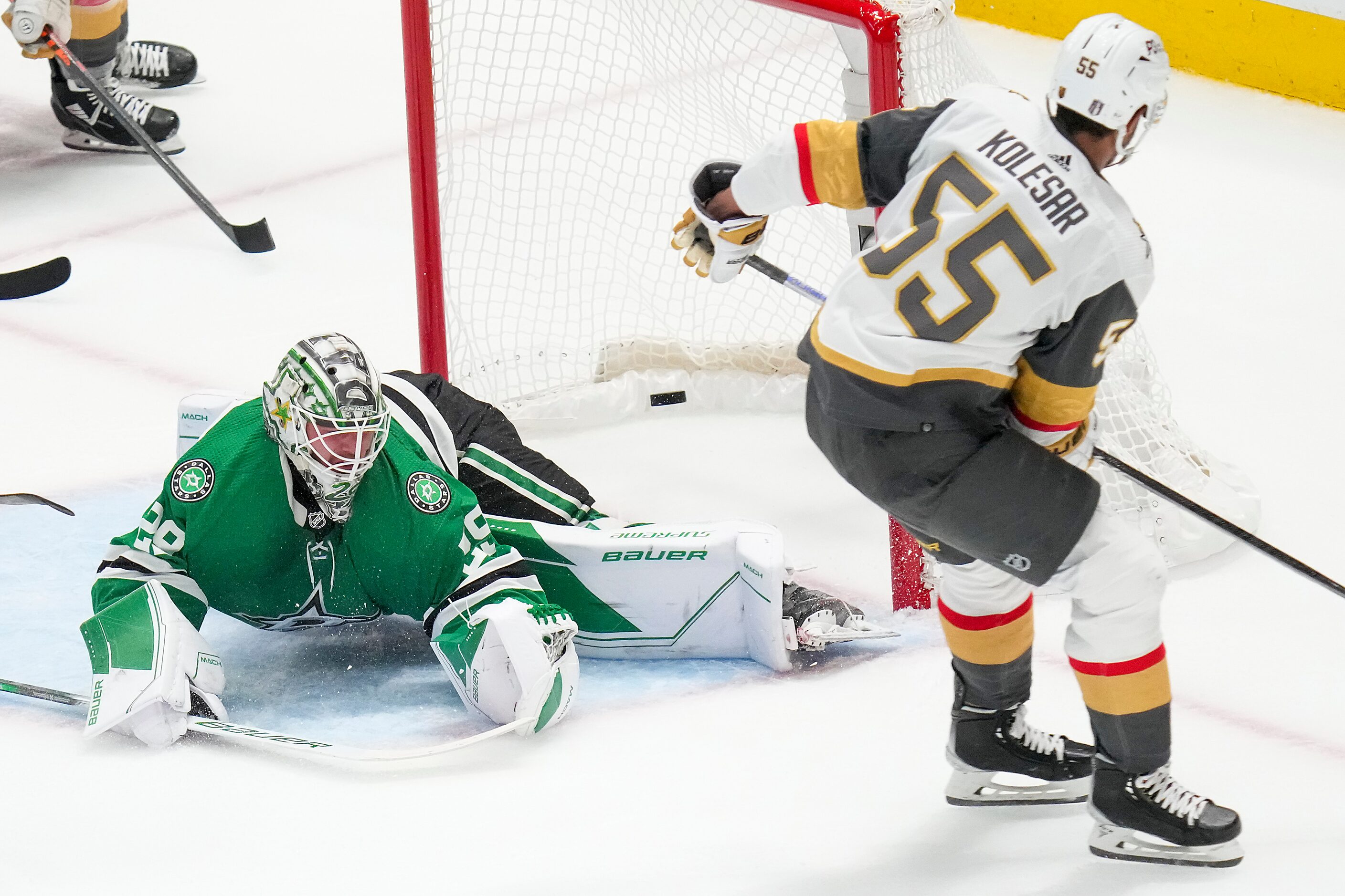 A shot by Vegas Golden Knights right wing Keegan Kolesar (55) gets past Dallas Stars...