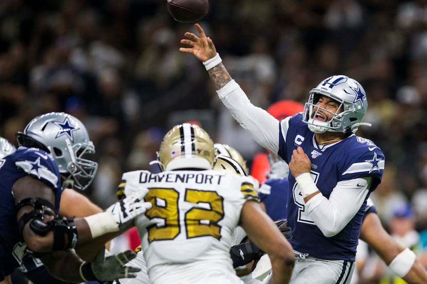 Dallas Cowboys quarterback Dak Prescott (4) throws a pass during the third quarter of an NFL...