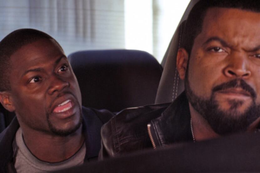 This image released by Universal Pictures shows Ice Cube, right, and Kevin Hart in a scene...