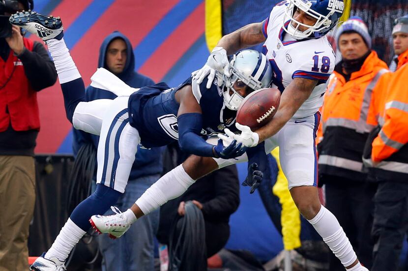 Dallas Cowboys cornerback Jourdan Lewis (27) broke a pass intended for New York Giants...