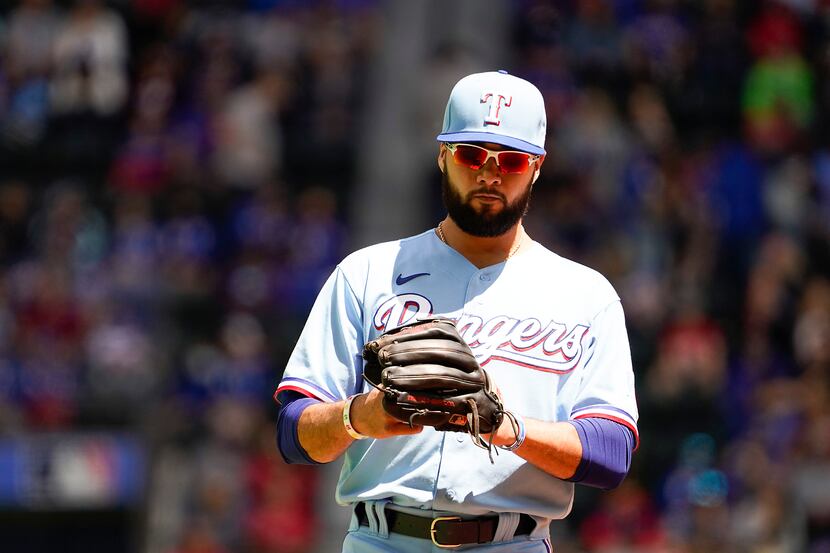 Texas Rangers shortstop Isiah Kiner-Falefa takes the field for the sixth inning against the...