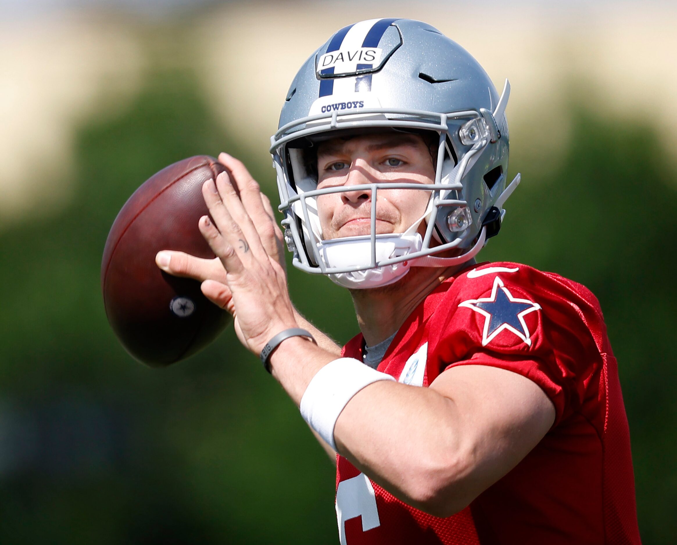 Dallas Cowboys rookie quarterback Brady Davis (6) throws on the run during rookie minicamp...