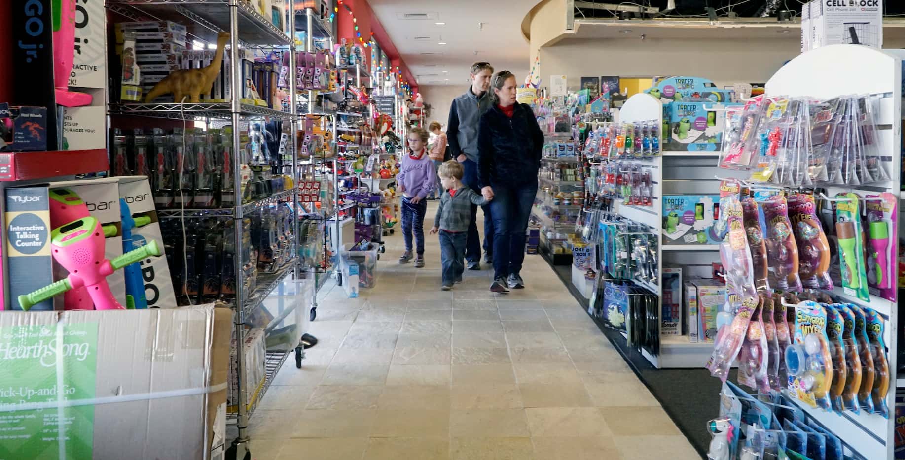Families do their last minute Christmas shopping at Toy Maven in Dallas, Texas on Tuesday,...