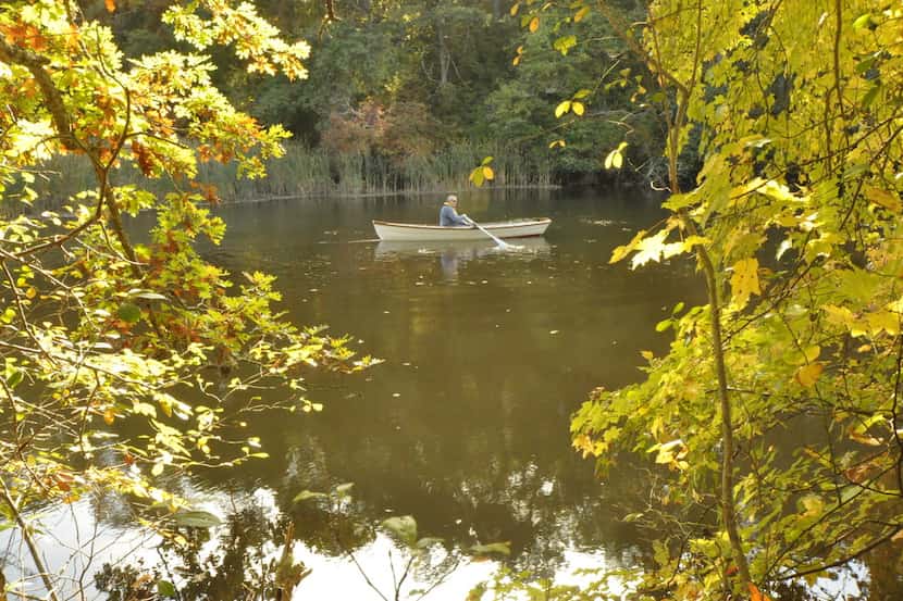 A boater takes a canoe break in the Mashpee River Woodlands in Cape Cod, Mass.