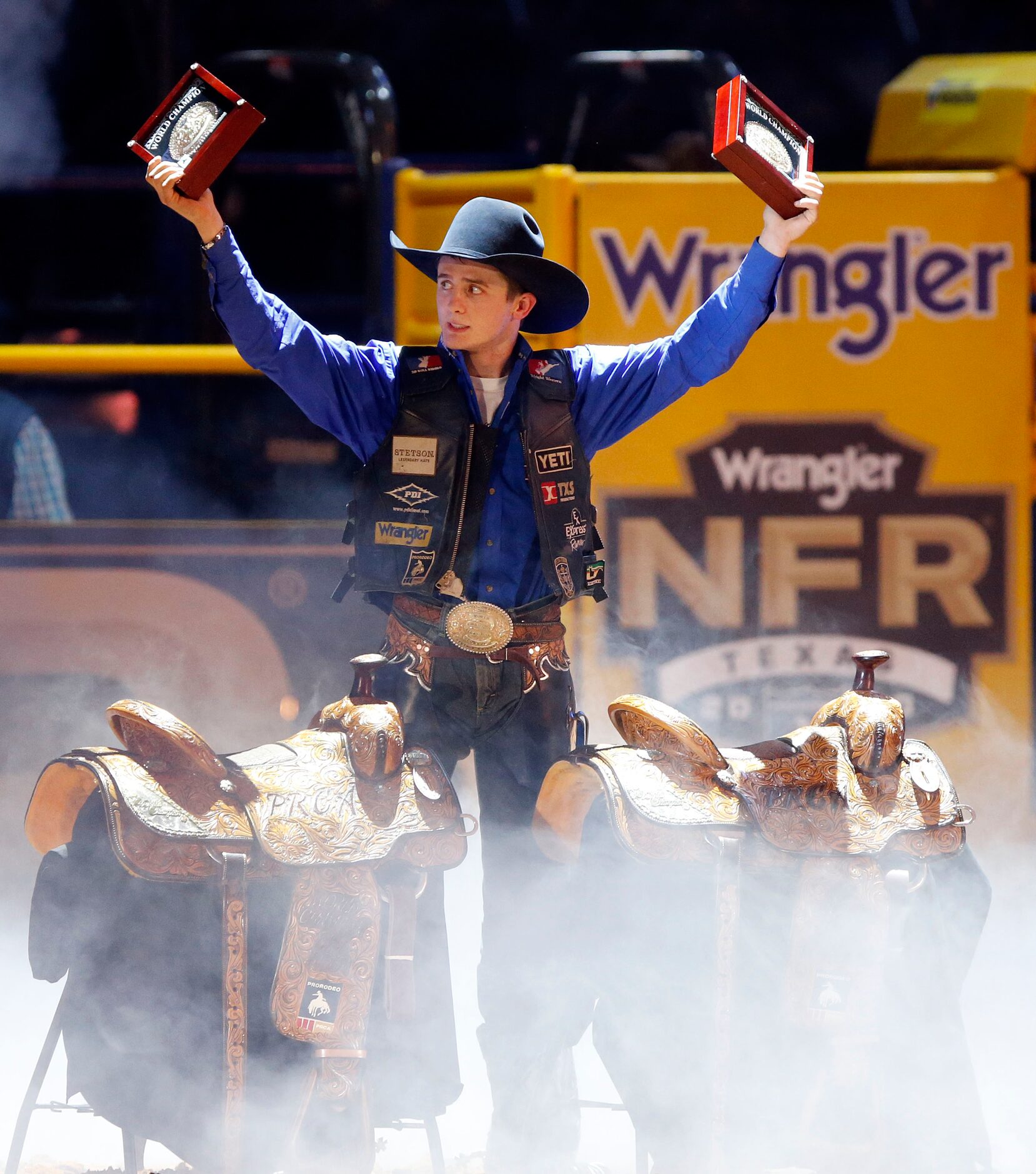 Bull Riding Champion Stetson Dell Wright (right) of Milford, Utah celebrates winning the...