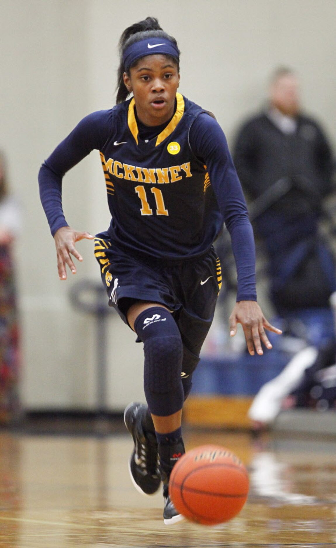 McKinney guard Quincy Noble (11) brings the basketball up the floor during the first quarter...