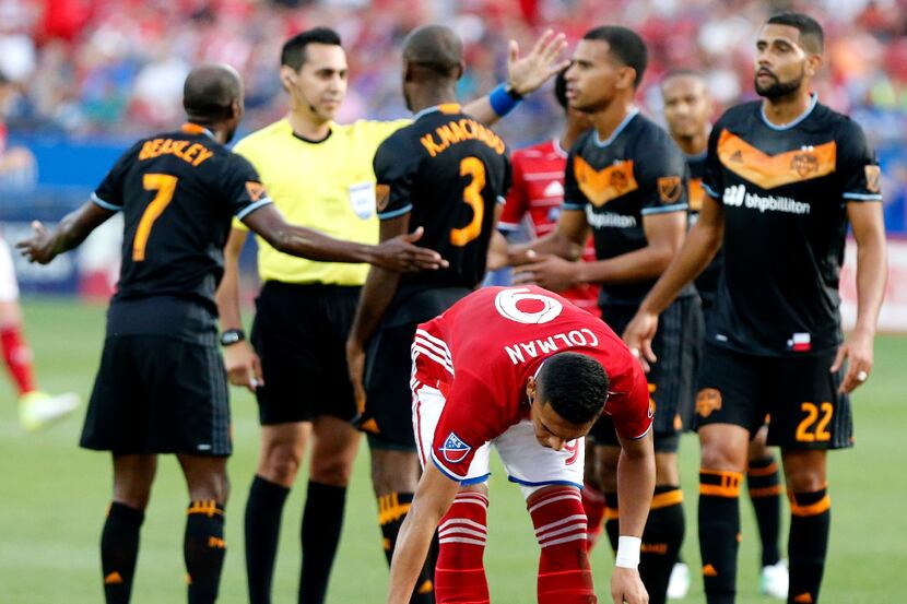 FC Dallas midfielder Michael Barrios (21) went down momentarily as was checked on by FC...