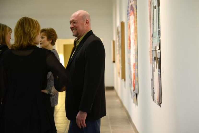 
Cohn Drennan chats with patrons at his gallery on Dragon Street during the design...