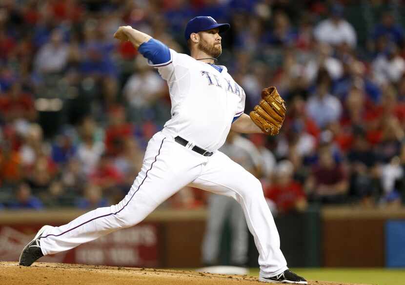 Texas Rangers starting pitcher Colby Lewis (48) pitches in a  game against the Detroit...