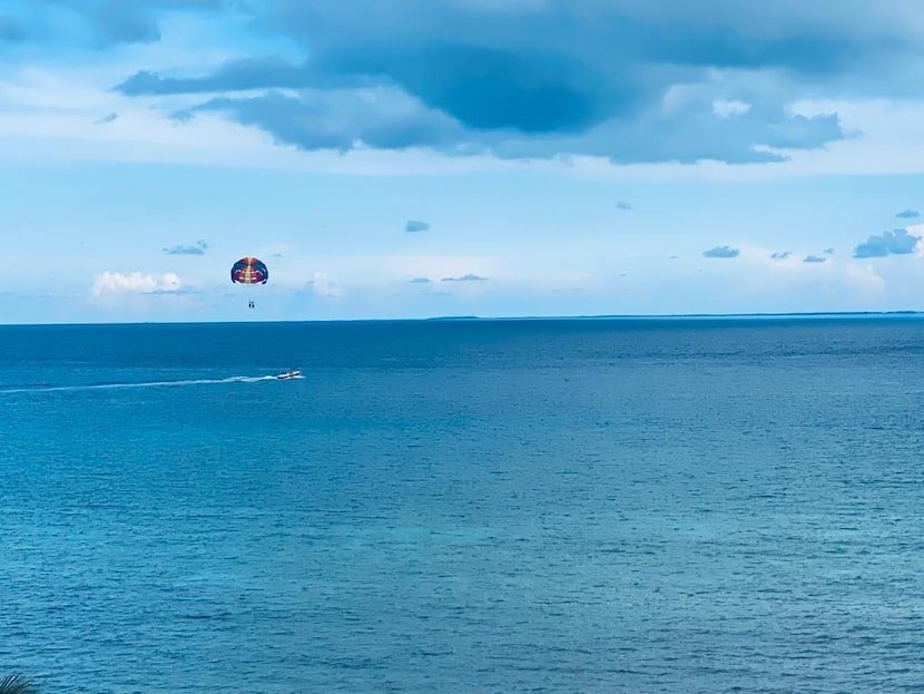 One of the many attractions of Cancún beaches is parachuting over the turquoise waters of...