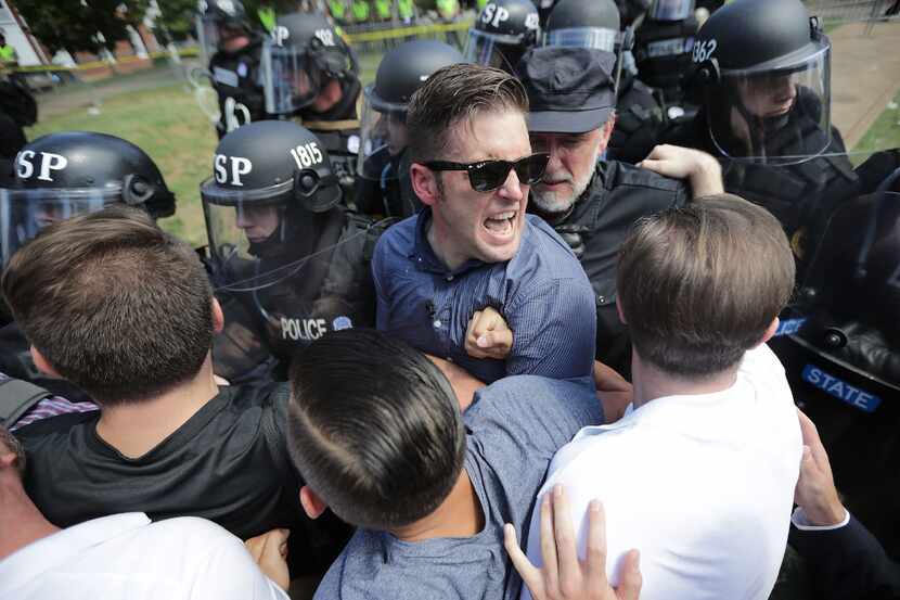 White nationalist Richard Spencer, formerly of Dallas, and his supporters clash with...