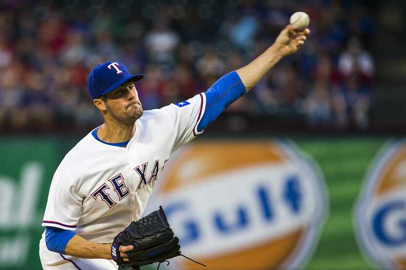 Texas Rangers starting pitcher Cole Hamels pitches during the third inning against the...