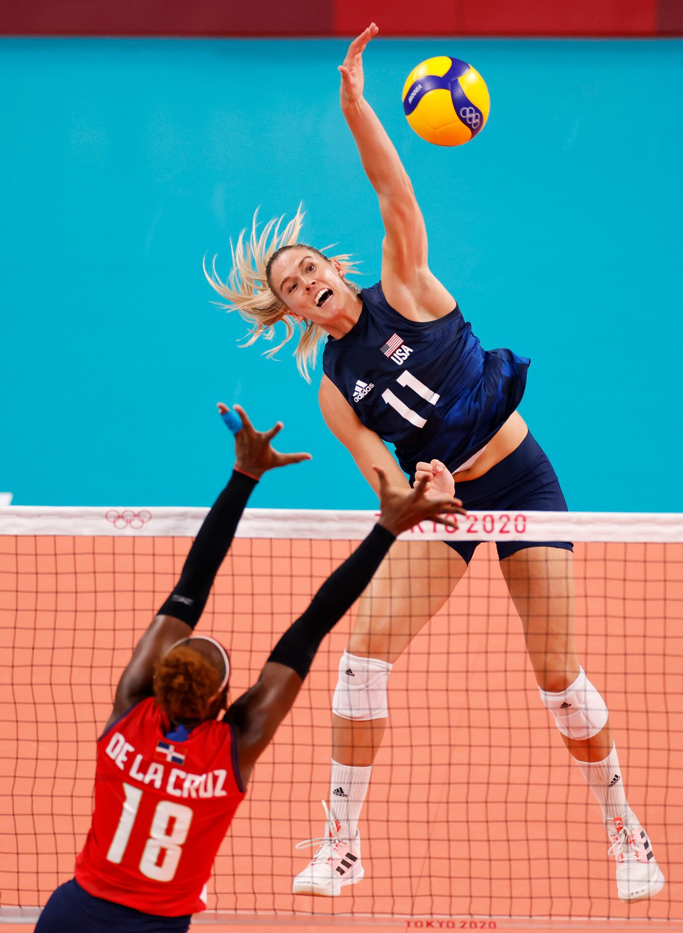 USA’s Andrea Drews (11) spikes the ball as Dominican Republic’s Bethania de la Cruz de Pena...