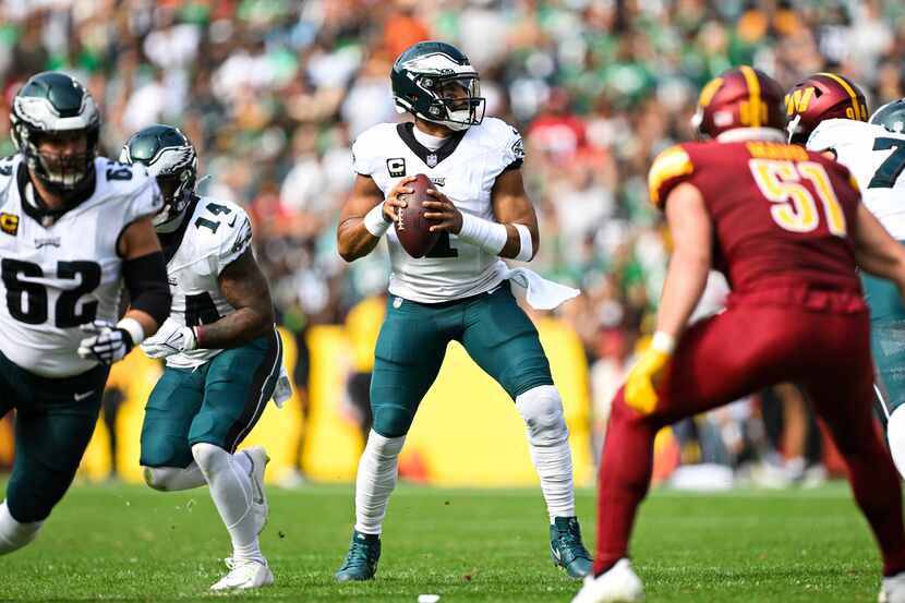 Philadelphia Eagles quarterback Jalen Hurts (1) looks to pass the ball during the first half...