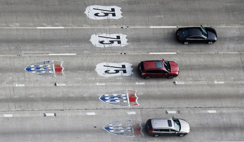 Vehicles approach the Interstate 635 and 75 South Central Expressway split in Dallas, Texas...