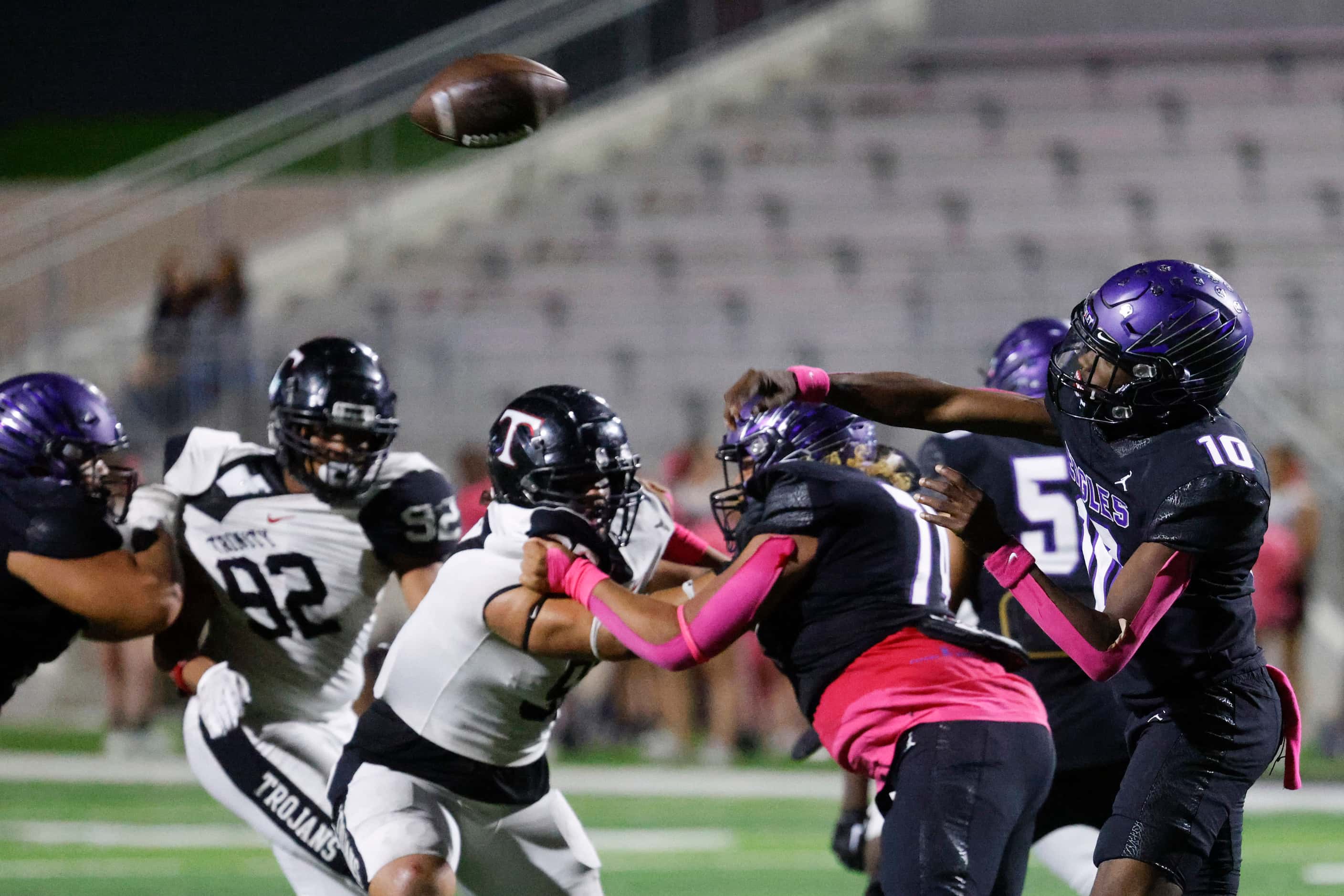 Crowley High’s Caleb Wiliams (10) throws the ball against Trinity High during the first half...