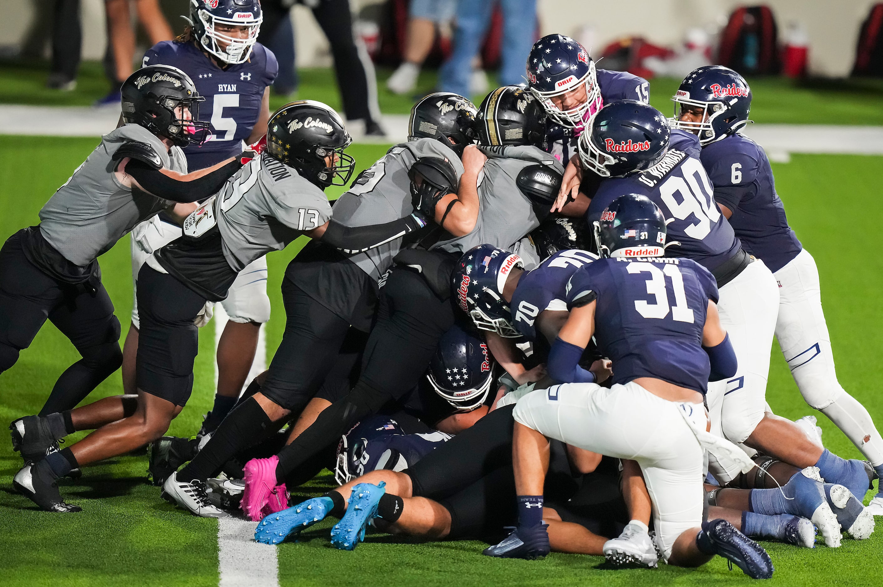 Denton Ryan quarterback TJ Hobbs (15) is stopped short of the end zone by The Colony defense...