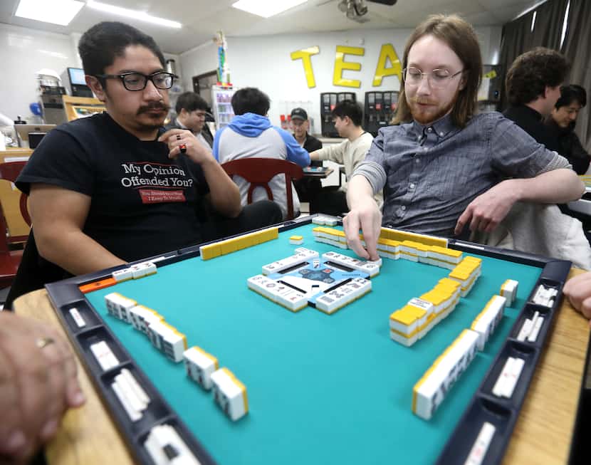 Brandon Castaneda, left, and Andrew Klein play riichi mahjong at Dubs Tea N' Eats in Plano.