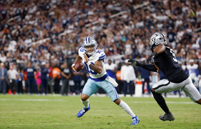 Dallas Cowboys quarterback Trey Lance (19) took off with the ball after faking a handoff...