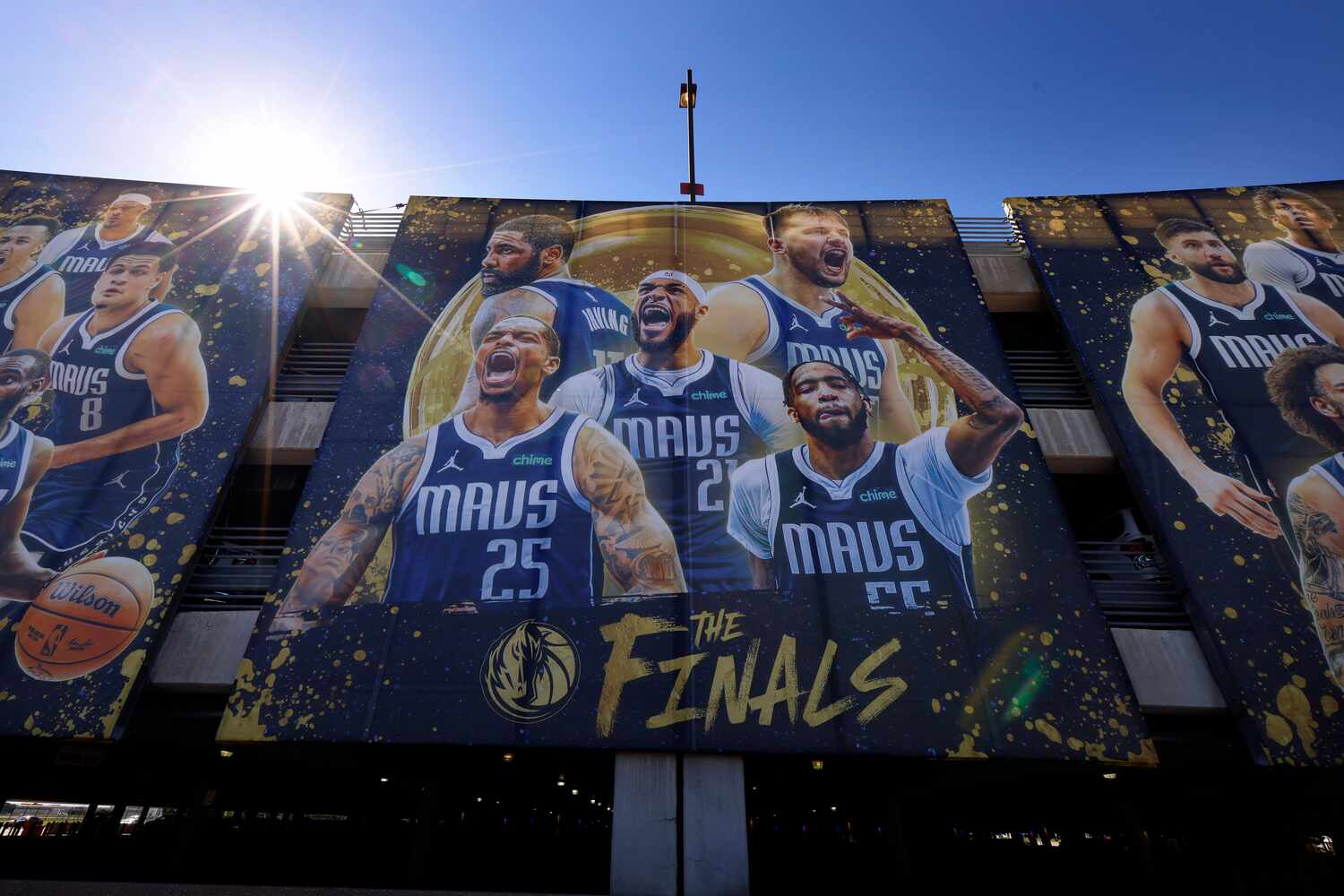 A Dallas Mavericks mural on a Dallas Love Field parking garage promotes the NBA Finals which...