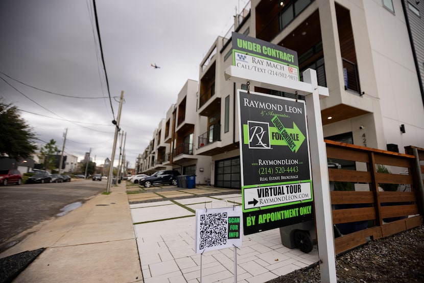 An “Under Contract” sign outside of a single-family attached home in Old East Dallas on...