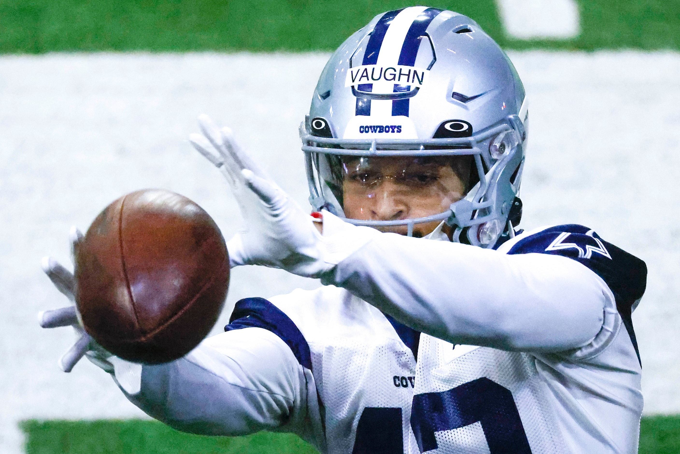 Dallas Cowboys running back Deuce Vaughn catches during Dallas Cowboys OTA practice on...