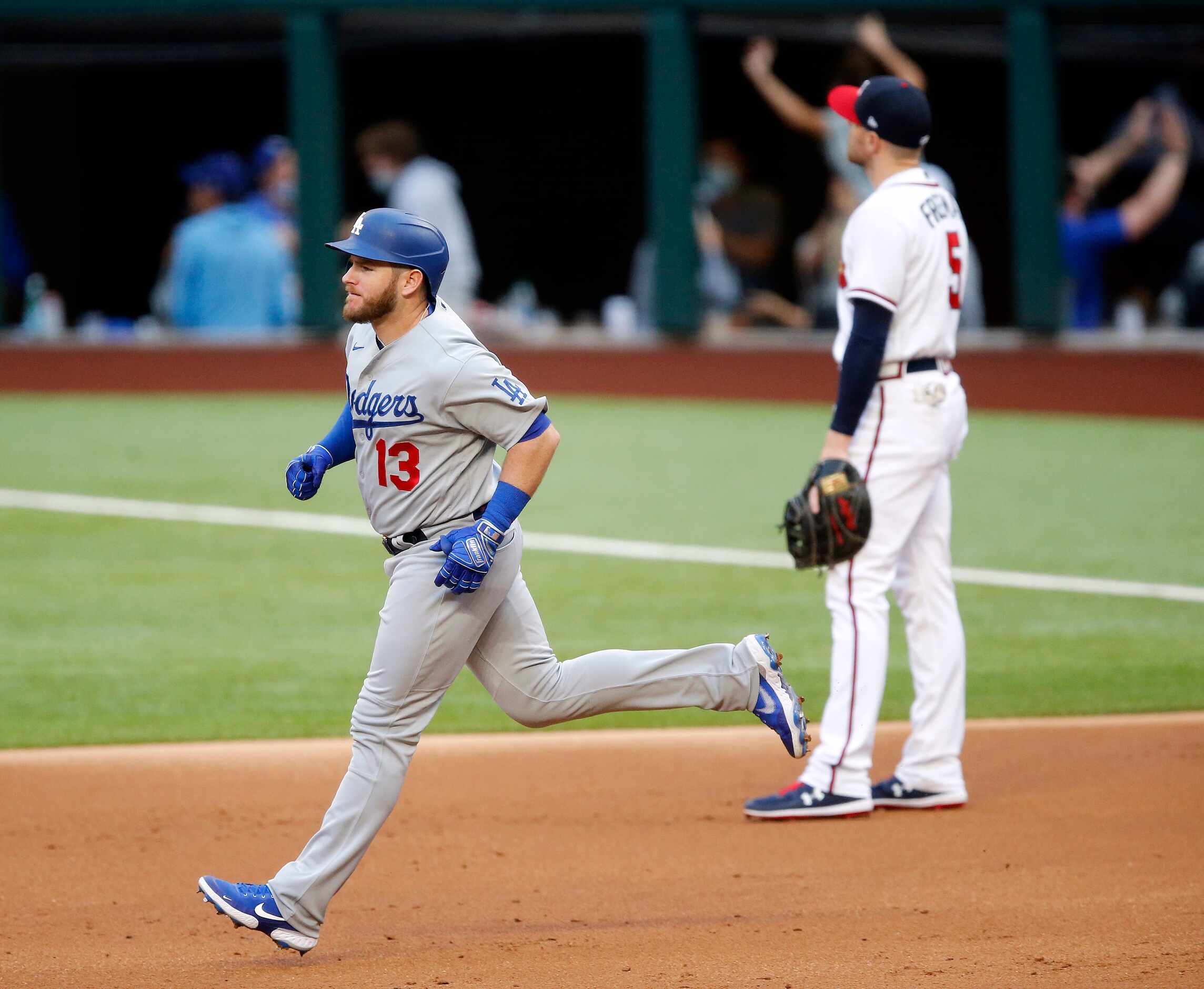 Los Angeles Dodgers batter Max Muncy (13) rounds the bases after his first inning grand slam...